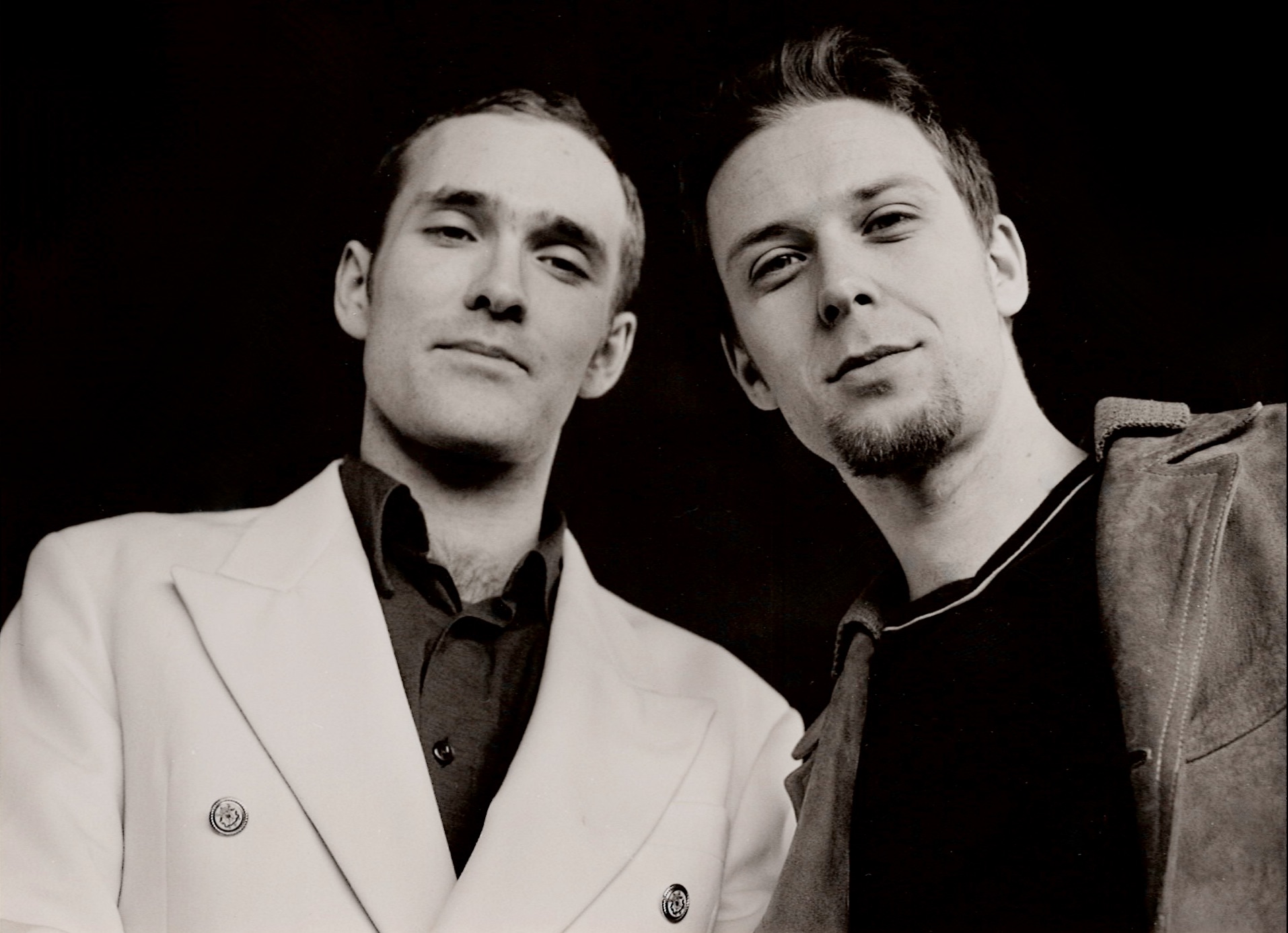 Black and white portrait of the two Audio Lotion musicians